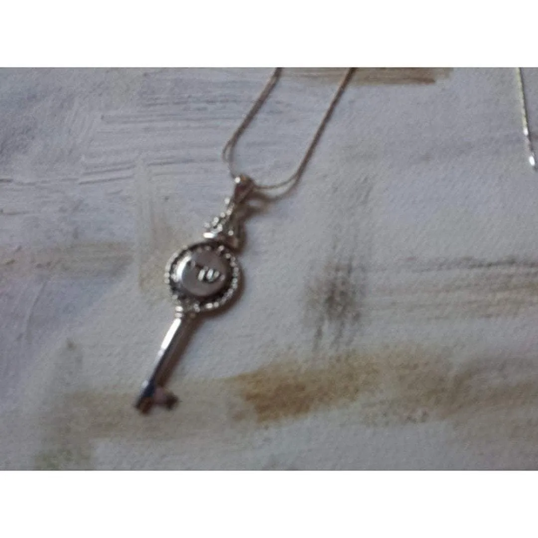 Key necklace with an Hebrew inscription Shadai